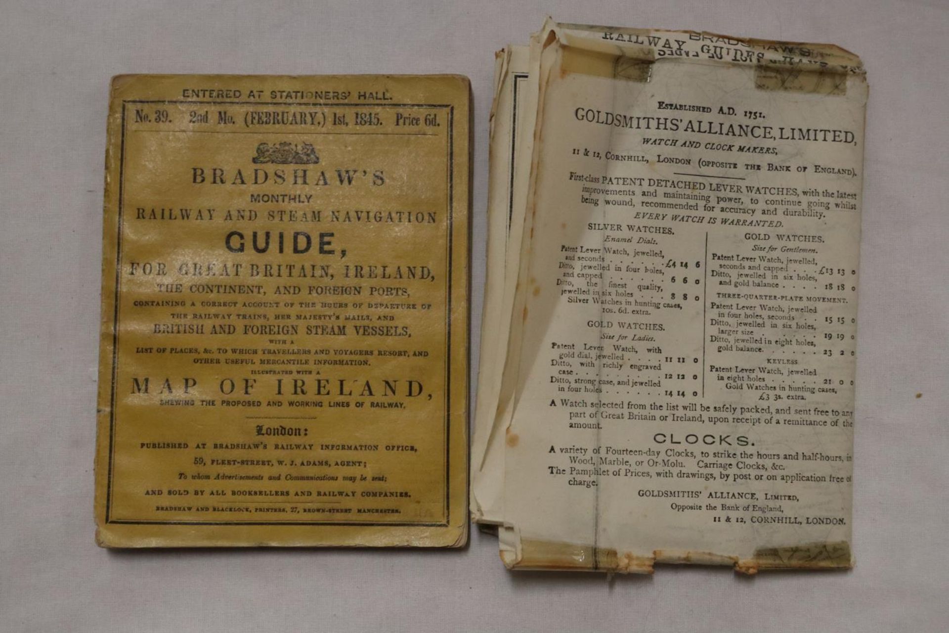 A BRADSHAWS MONTHLY RAILWAY GUIDE DATED FEBRUARY 1845, PAPERBACK VERSION AND A FOLD OUT RAILWAY MAP