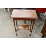 AN EARLY 20TH CENTURY OAK TWO TIER CENTRAL TABLE ON TAPERING LEGS WITH SPADE FEET 23" X 14"