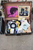 A SUITCASE WITH AN ASSORTMENT OF LP RECORDS AND 7" SINGLES