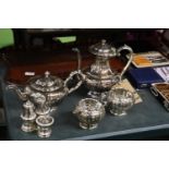 A SILVER PLATED TEASET TO INCLUDE A TEAPOT, COFFEE POT, SUGAR BOWL, CREAM JUG AND A CRUET SET