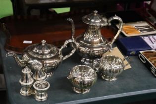 A SILVER PLATED TEASET TO INCLUDE A TEAPOT, COFFEE POT, SUGAR BOWL, CREAM JUG AND A CRUET SET