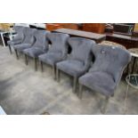 A SET OF SIX MODERN WINGED DINING CHAIRS ON POLISHED CHROME LEGS WITH LION MASK HANDLES TO BACKS