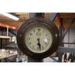 A VINTAGE MAHOGANY CASED ROUND WALL CLOCK