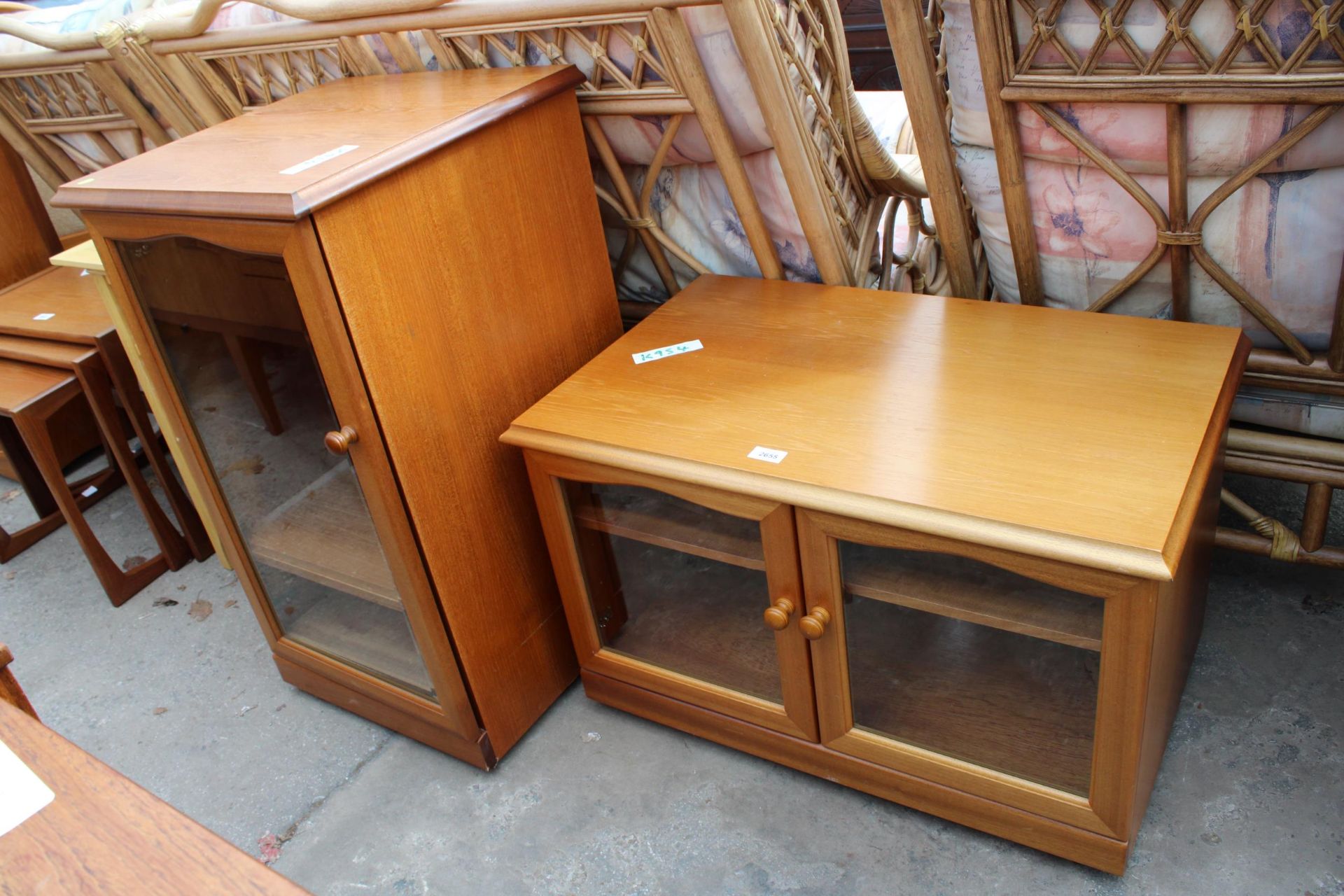A RETRO TEAK SUTCLIFFE CABINET AND STAND