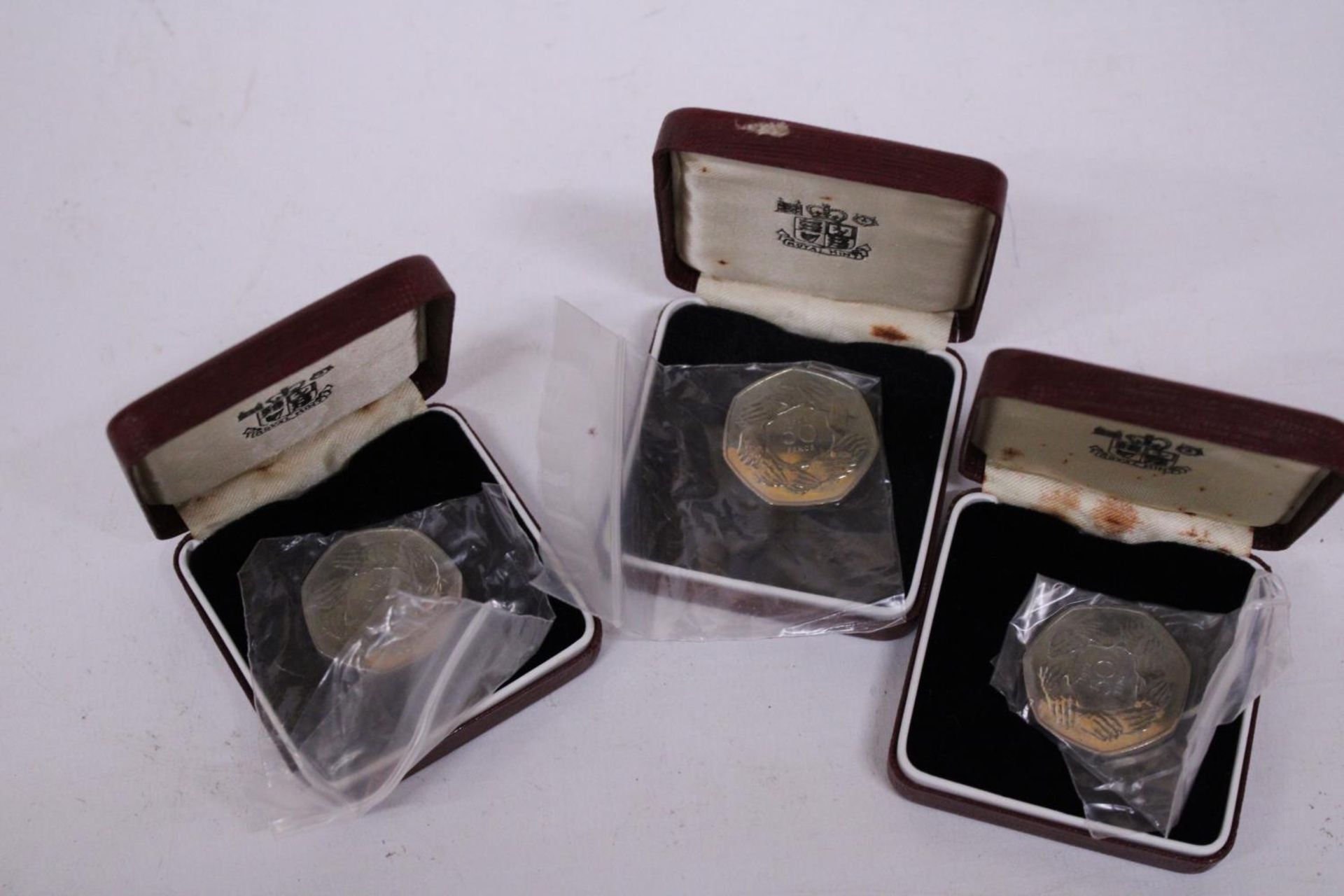 UK , THREE BOXED 1973 SILVER 50P COINS