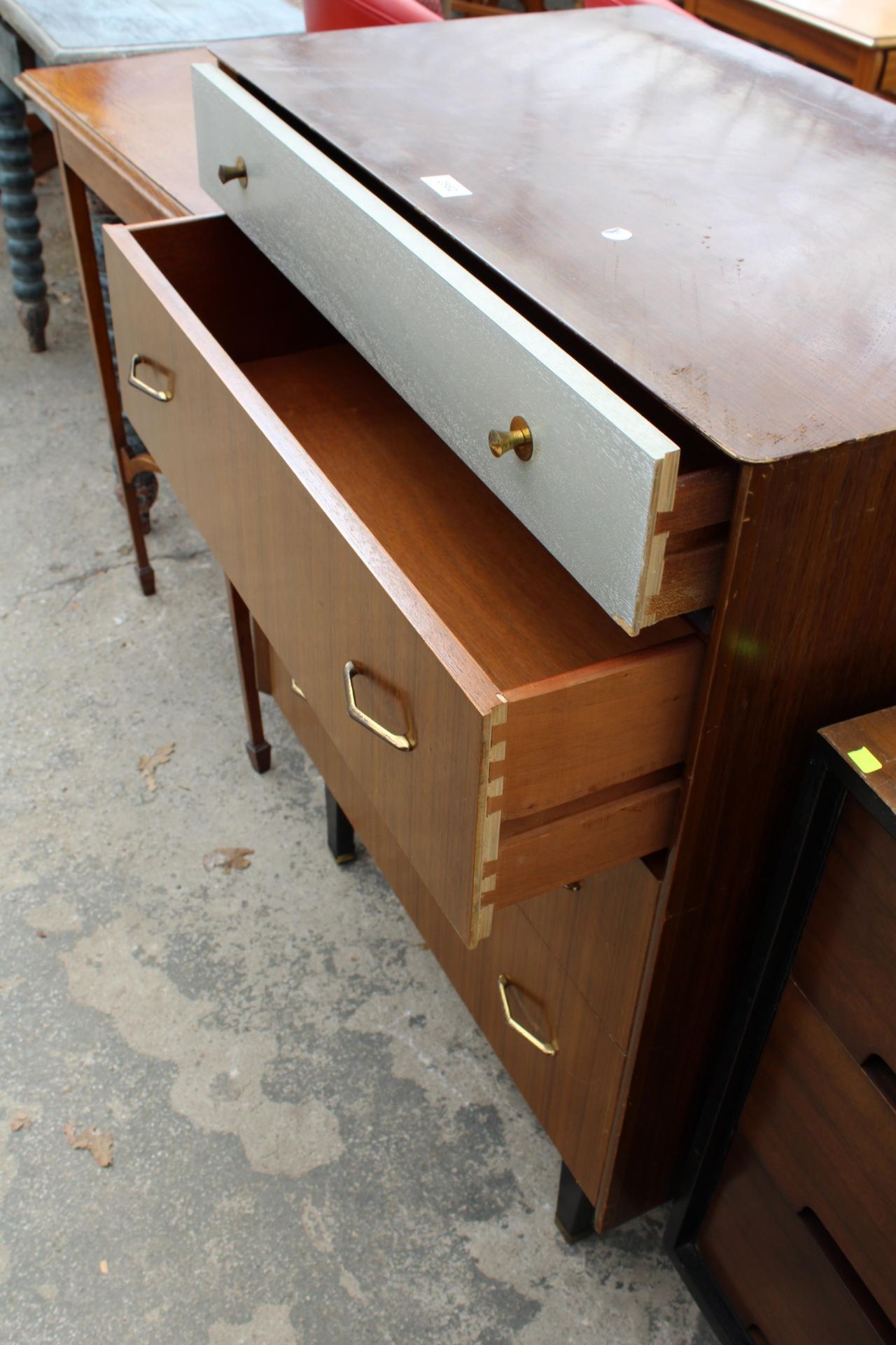 A RETRO TEAK CHEST OF FOUR DRAWERS, THE TOP DRAWER BEING SILVER COLOURED, ALL WITH BRASS HANDLES - Image 2 of 3