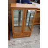 A MODERN TWO DOOR GLAZED DISPLAY CABINET WITH DRAWER TO BASE, 29" WIDE