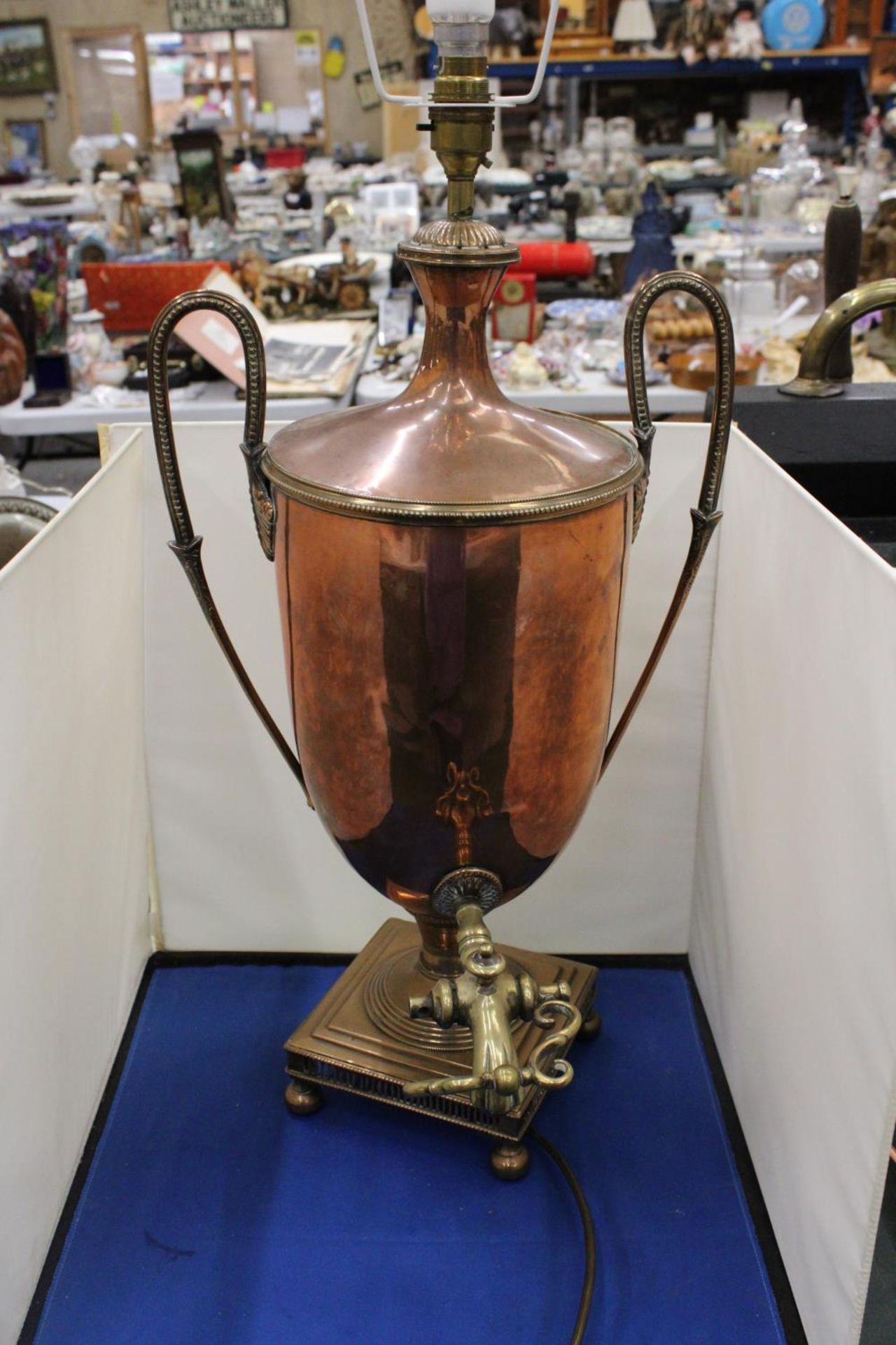 A BRASS AND COPPER SAMOVAR CONVERTED TO A LAMP
