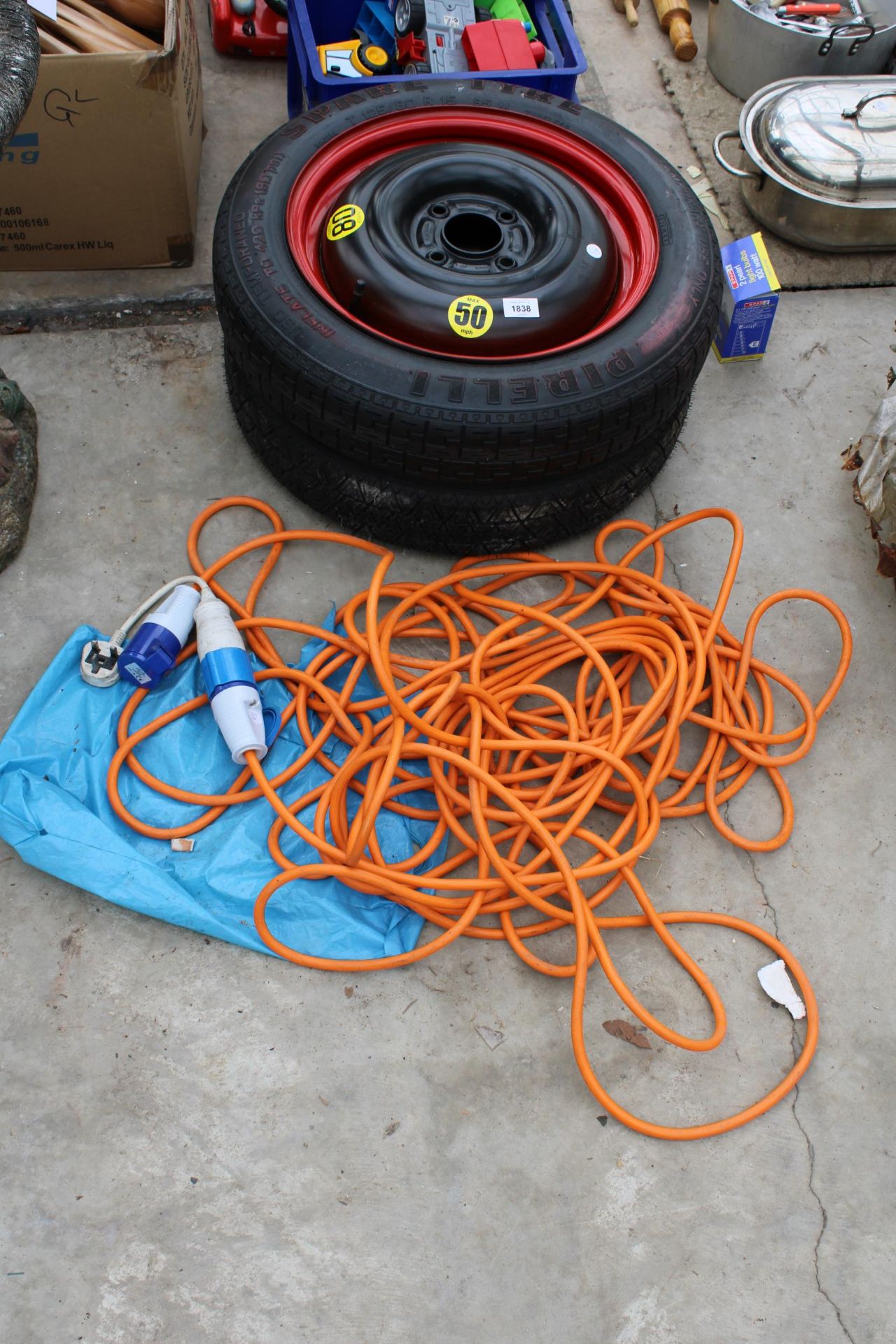 TWO CAR WHEELS AND AN EXTENSION LEAD