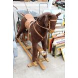 A CHILDS PLUSH AND WOODEN ROCKING HORSE