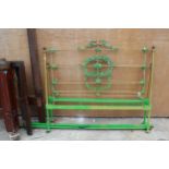 A BRASS AND IRON 4'6" BEDSTEAD DECORATED WITH LEAVES