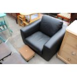 A MODERN HABITAT BLACK FAUX LEATHER EASY CHAIR AND MISS MUFFET STOOL