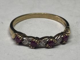 A 9 CARAT GOLD RING WITH RUBIES AND DIAMONDS ON A TWIST DESIGN SIZE T
