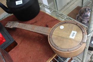 A SMALL VINTAGE BANJO