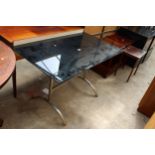 A RETRO DINING TABLE WITH SMOKE DGLASS TOP, 47" X 27" ON STAINLESS STEEL BASE