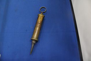 A VINTAGE BRASS SYRINGE WITH MAKERS CREST