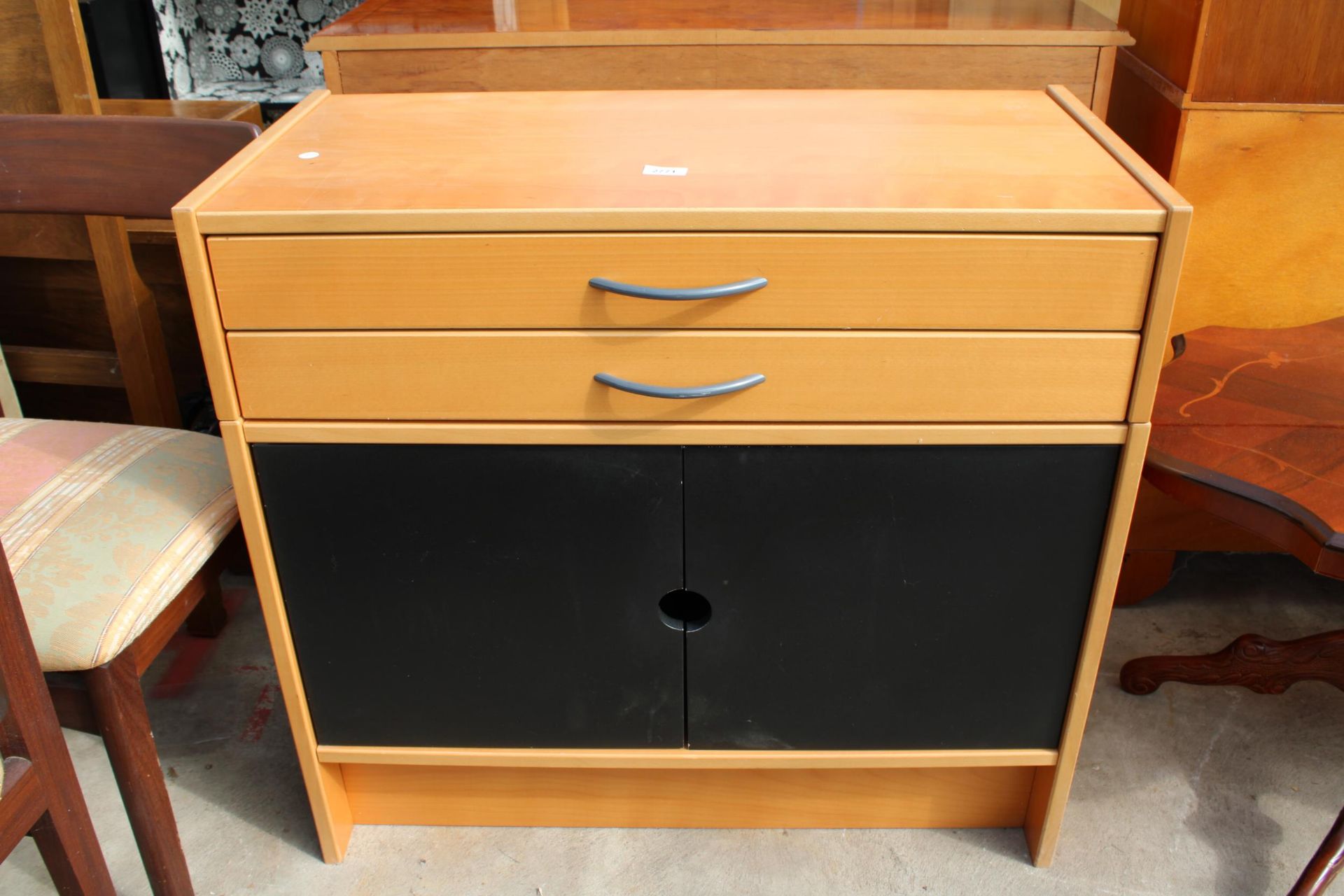 A MODERN SIDE CABINET ENCLOSING TWO DRAWERS AND TWO BLACK PAINTED CUPBOARDS, 33" WIDE