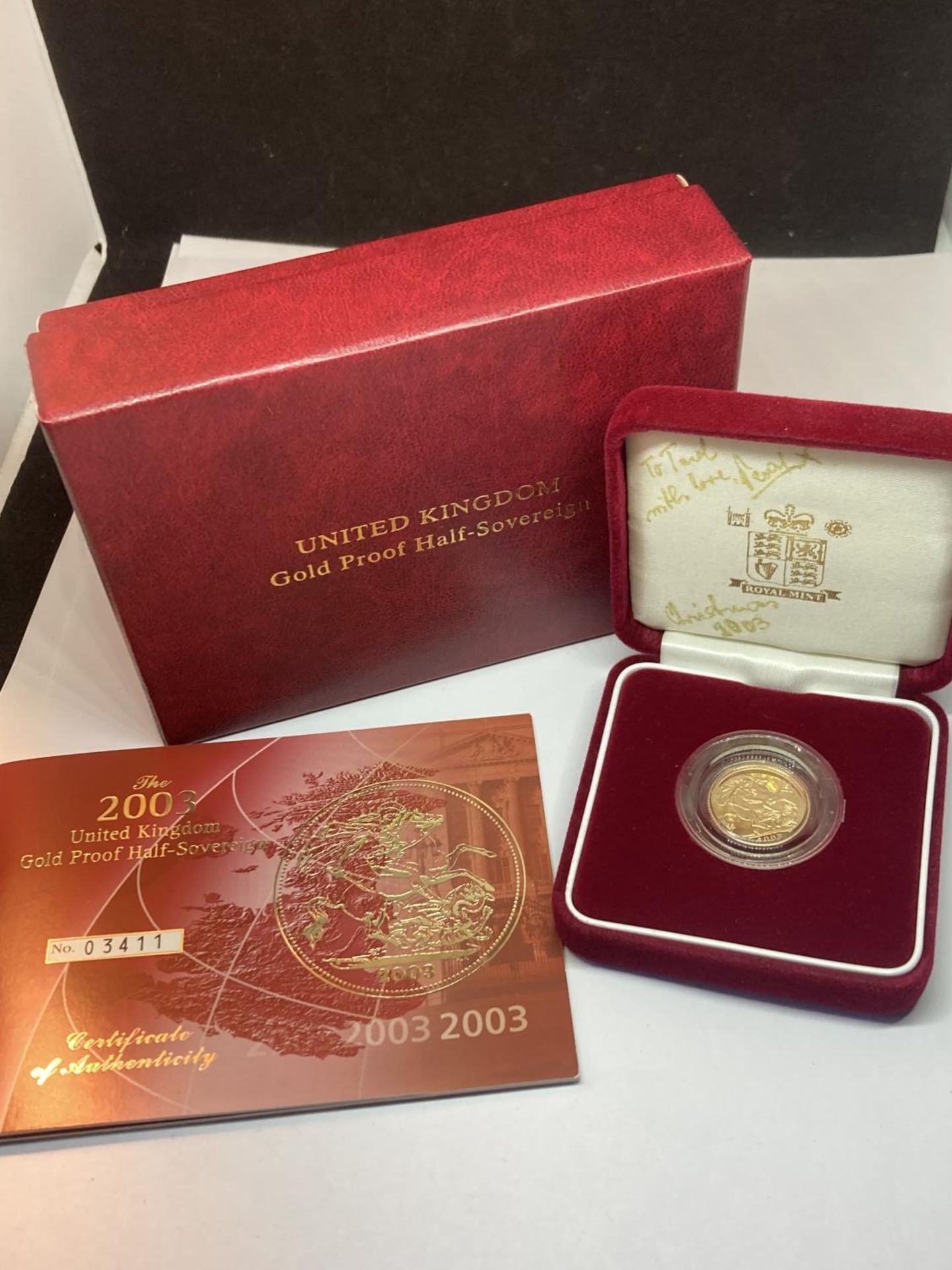 A 2003 GOLD PROOF HALF SOVEREIGN NO 03411 OF 10,000 IN A PRESENTATION BOX WITH CERTIFICATE OF