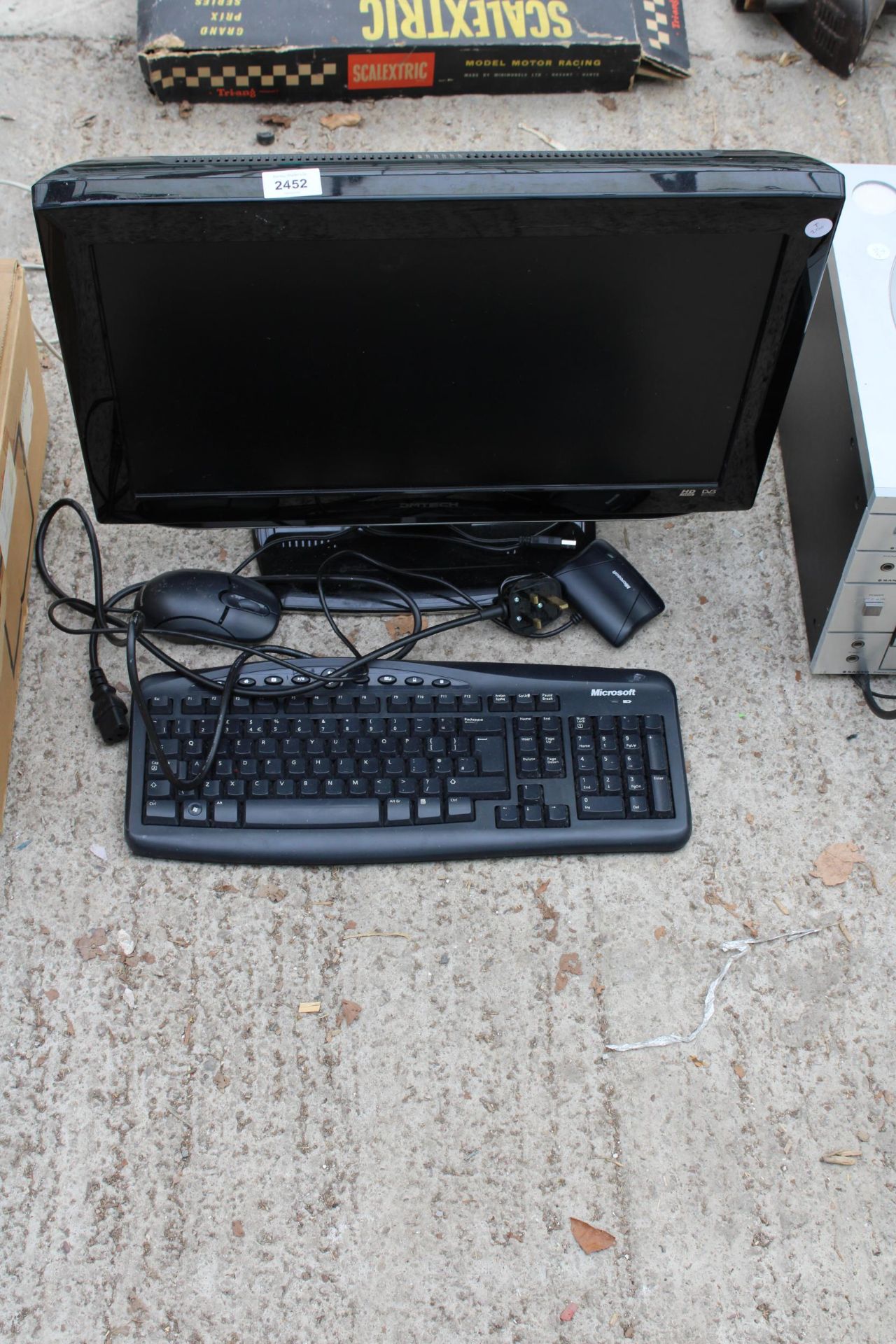 A DMTECH TELEVISION, A COMPUTER KEYBOARD AND MOUSE