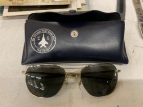 A PAIR OF SUNGLASSES IN A "THE ORIGINAL PILOT SUNGLASSES" TRUE COLOR CASE.