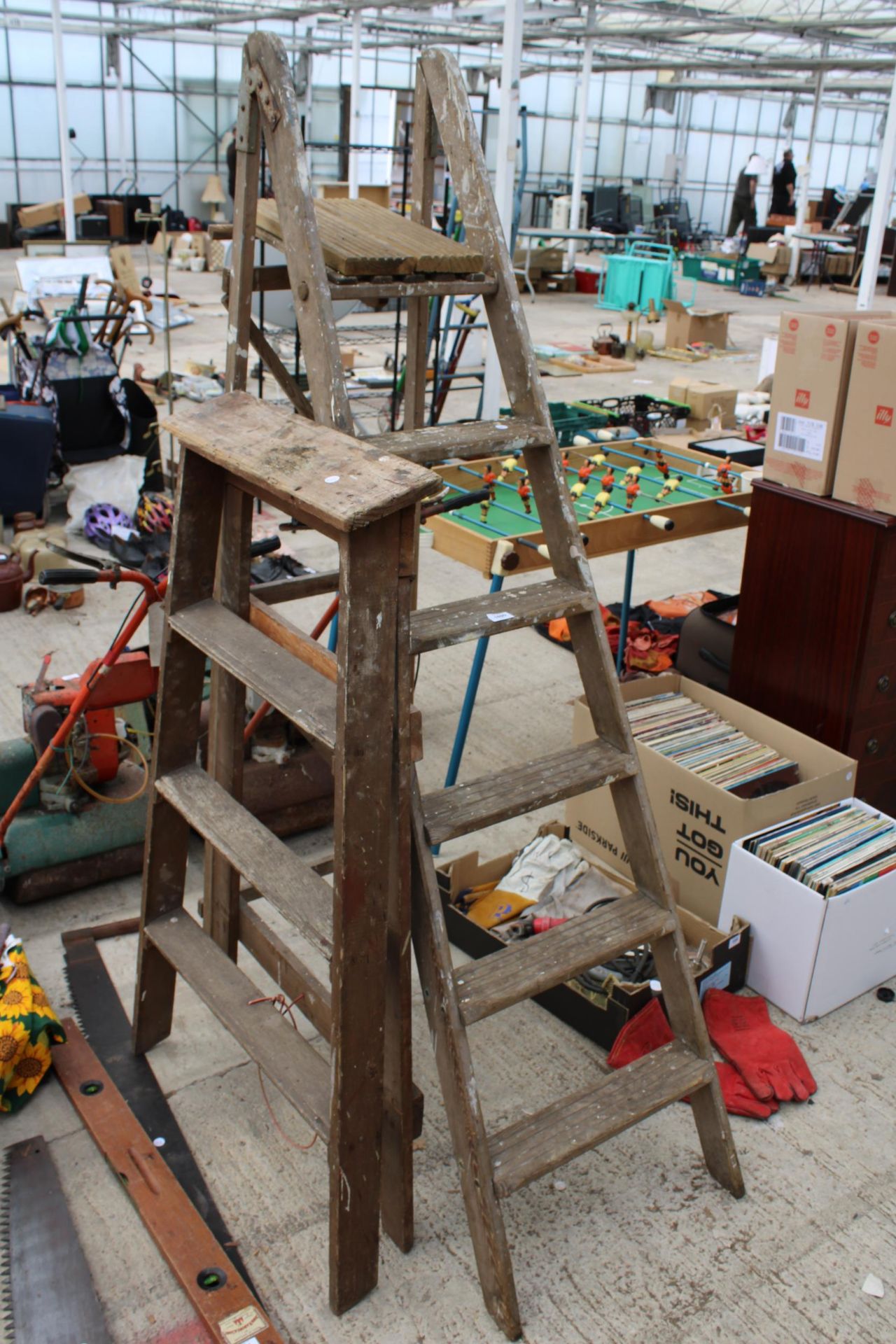 TWO VINTAGE WOODEN STEP LADDERS TO INCLUDE A FIVE RUNG AND A THREE RUNG