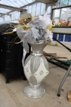 A MIRRORED DECORATIVE VASE