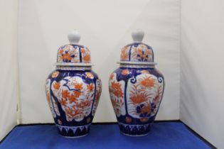 A PAIR OF IMARI LIDDED GINGER JARS