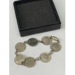 A SILVER JOEY BRACELET IN A PRESENTATION BOX