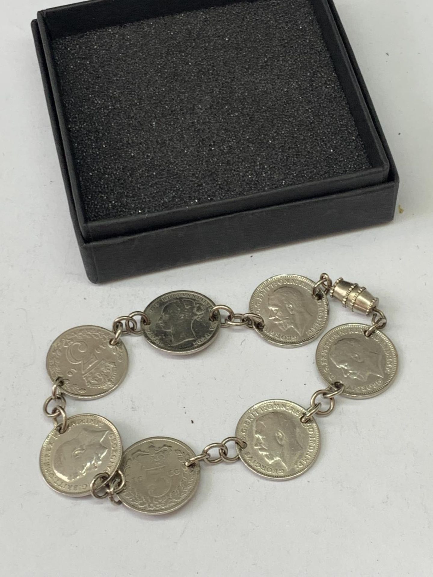 A SILVER JOEY BRACELET IN A PRESENTATION BOX