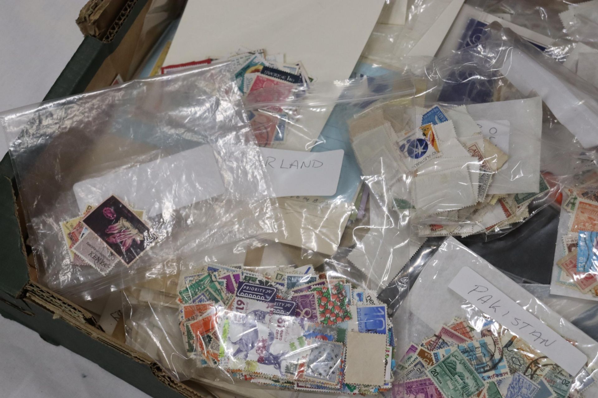 A LARGE QUANTITY OF USED STAMPS ON ENVELOPES AND STAMPS TO INCLUDE SPAIN, CANADA, MALTA, ETC., - Image 2 of 2