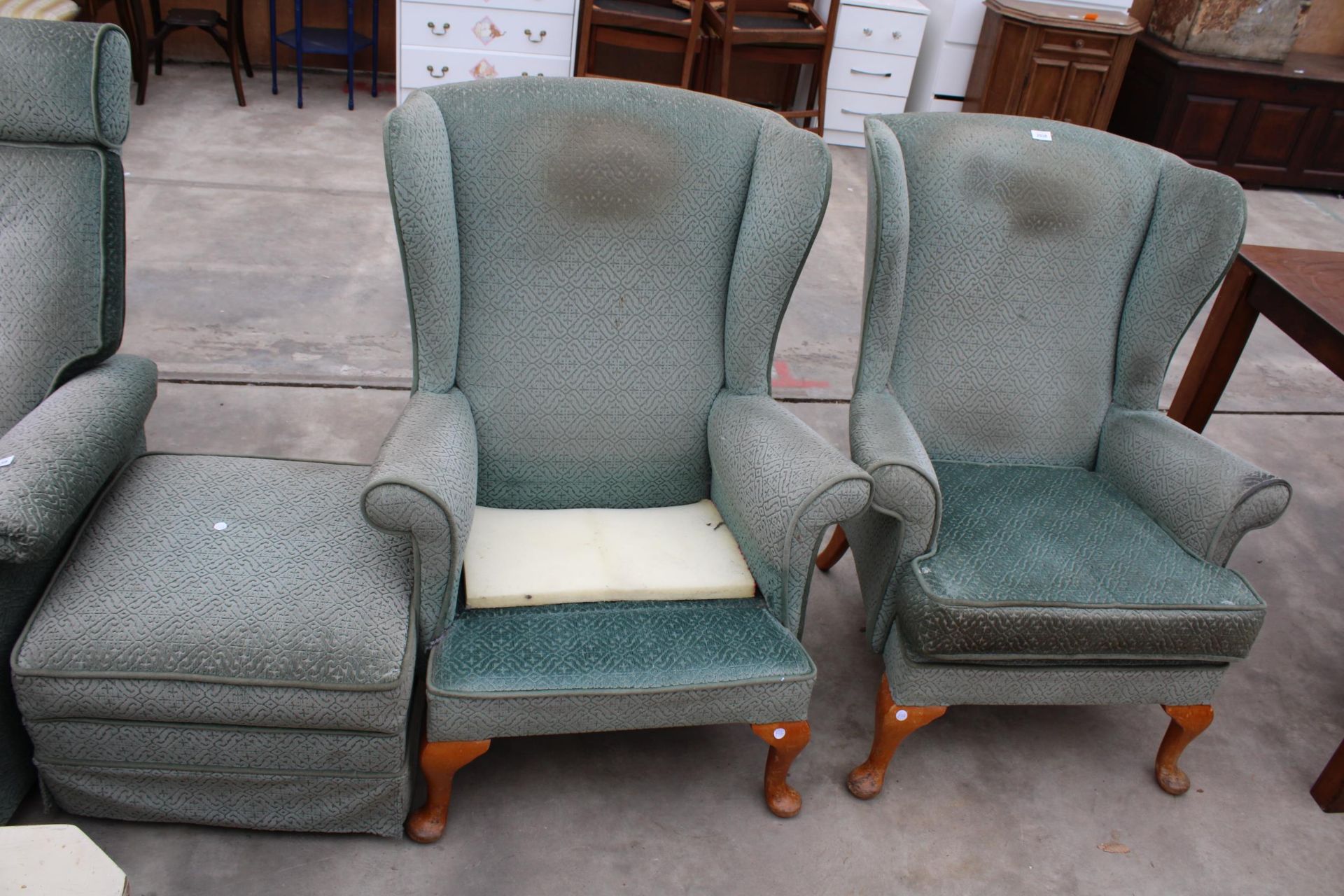 A PAIR OF PARKER KNOLL WINGED FIRESIDE CHAIRS ON FRONT CABRIOLE LEGS AND STOOL, MODEL NO. P.K.720.