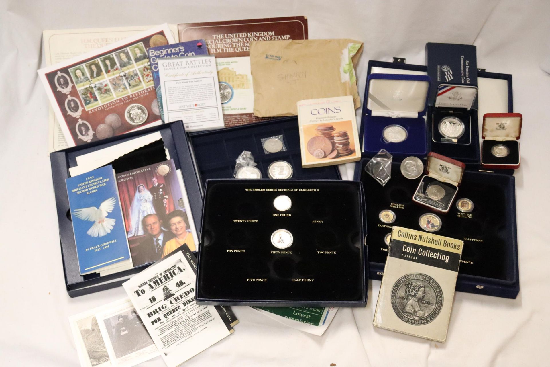 A SELECTION OF US AND UK COINS (DECIMAL AND PRE-DECIMAL INCLUDING A NUMBER IN CASES