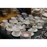 A QUANTITY OF TEACUPS AND SAUCERS TO INCLUDE ROYAL DOULTON "FANTASIA", WEDGWOOD, ROYAL ADDERLEY,