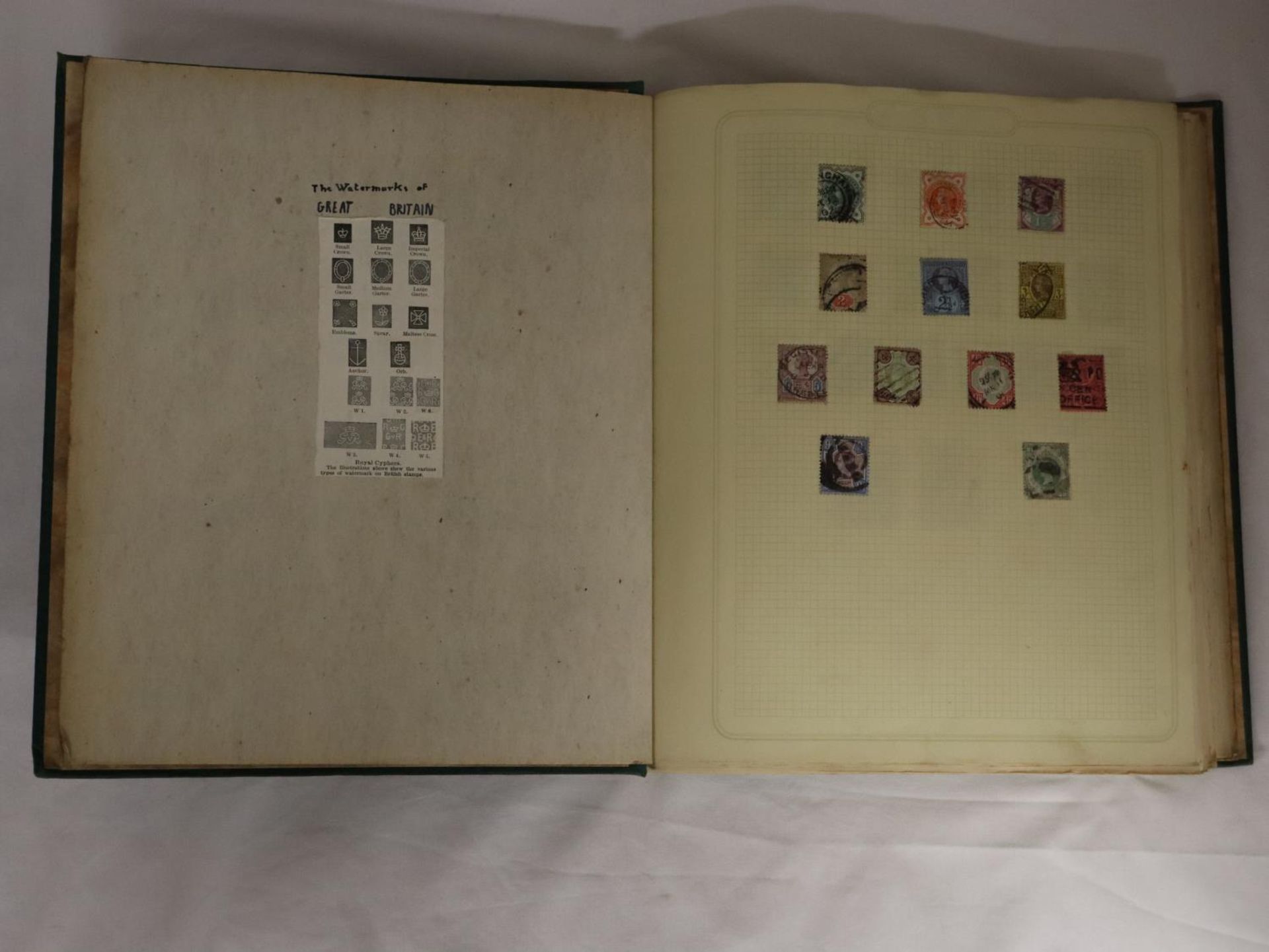 A GREEN LOOSE LEAF ALBUM HOUSING GB AND COMMONWEALTH STAMPS QV - GVI, NO QEII. GVI DEFINITIVE SETS