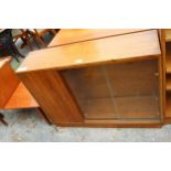 A RETRO TEAK BOOKCASE ENCLOSING CUPBOARD AND TWO GLASS SLIDING DOORS, 40" WIDE