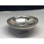 A TESTED TO SILVER DISH ON THREE BUN FEET GROSS WEIGHT 45.6 GRAMS
