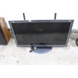 A PANASONIC 42" TELEVISION WITH REMOTE CONTROL