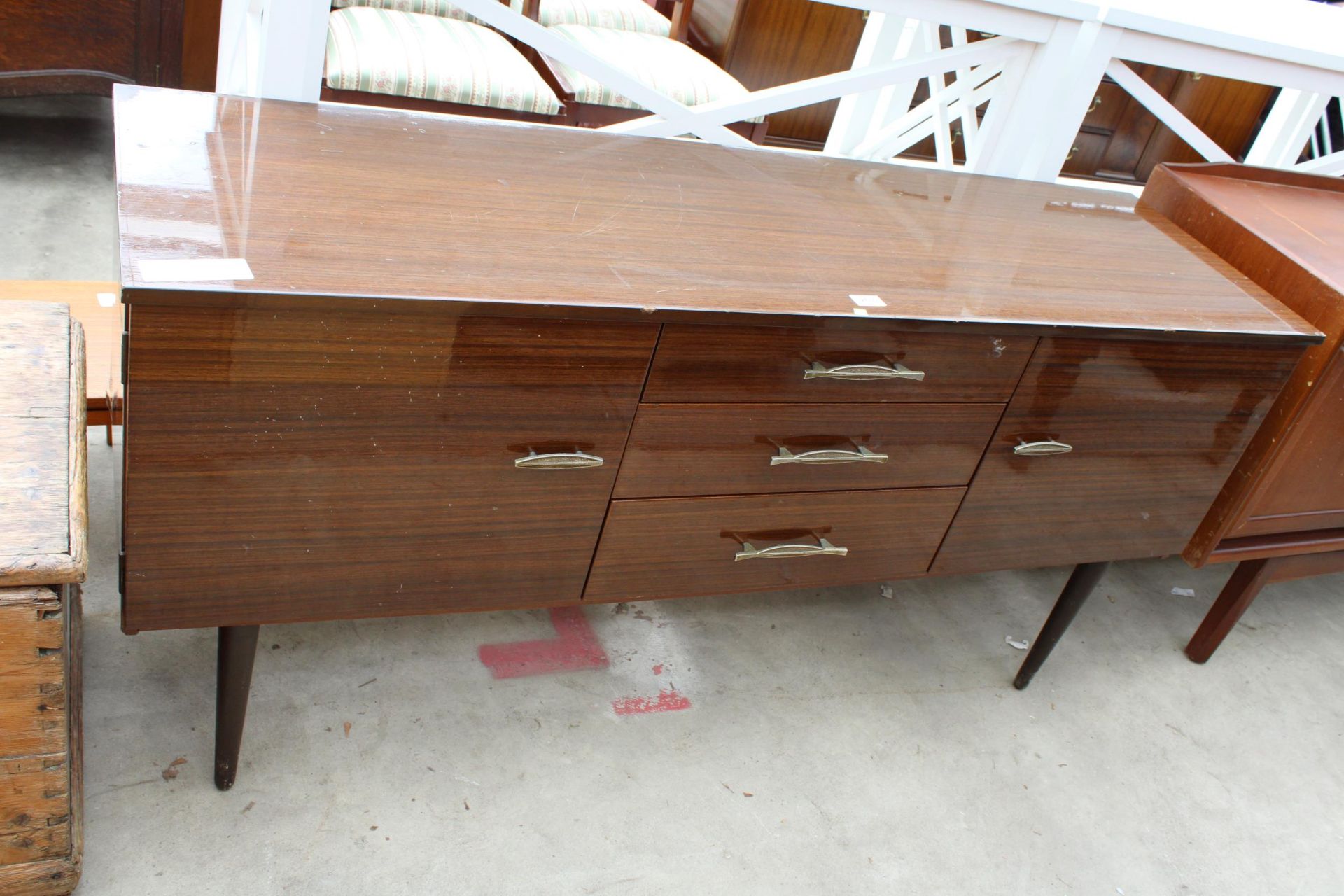 A RETRO SCHREIBER SIDEBOARD ENCLOSING THREE DRAWERS AND TWO CUPBOARDS, 59" WIDE