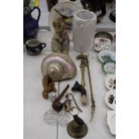 A MIXED LOT TO INCLUDE A LARGE IRIDESCENT SHELL, PRAYING HANDS, BRASSWARE, BOTTLE STOPPERS, FIGURES,