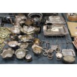 A VERY LARGE QUANTITY OF SILVER PLATED ITEMS TO INCLUDE TEAPOTS, COFFEE POTS, SERVING DISHES,
