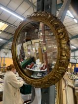 A ROUND CONVEX MIRROR IN GOLD FRAME - APPROXIMATELY 33CM DIAMETER