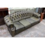 A GREEN LEATHER CHESTERFIELD FOUR SEATER SETTEE