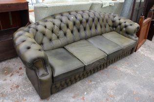 A GREEN LEATHER CHESTERFIELD FOUR SEATER SETTEE