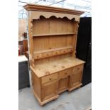 A MODERN PINE KITCHEN DRESSER WITH THREE CUPBOARDS AND THREE DRAWERS TO BASE COMPLETE WITH PLATE