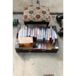 AN ASSORTMENT OF VHS AND DVDS AND A FOOT STOOL