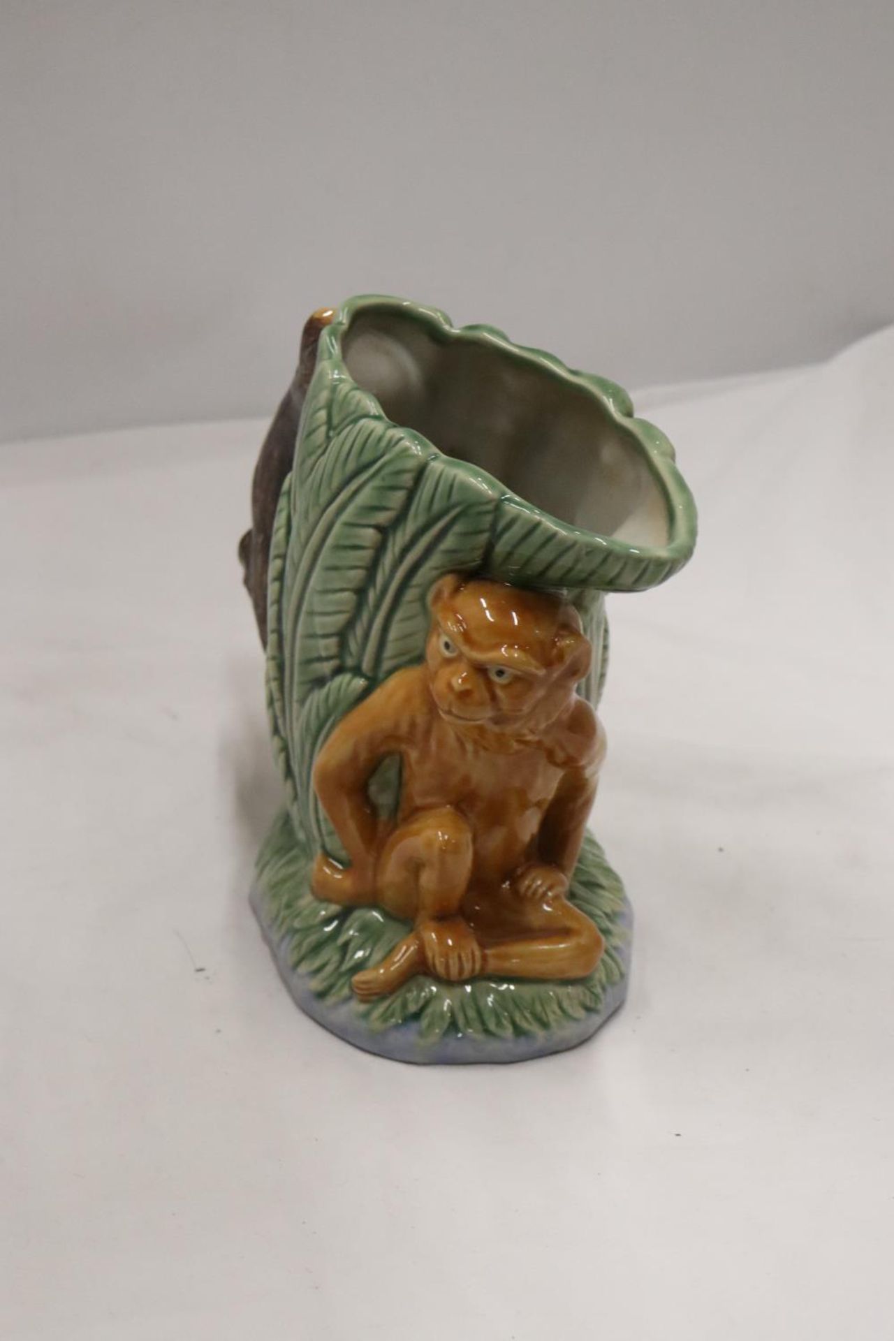 A MAJOLICA STYLE MONKEY VASE