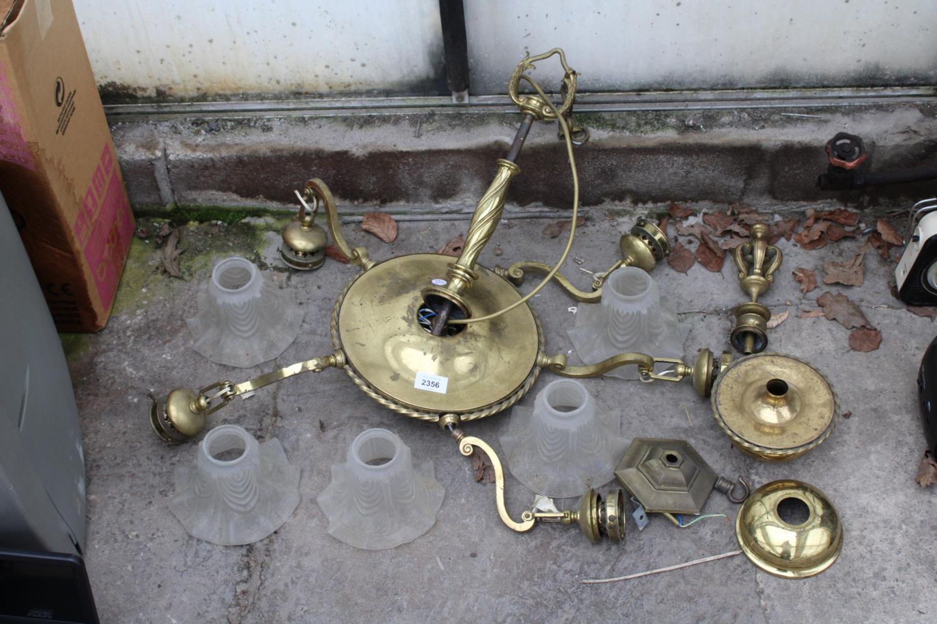 AN ASSORTMENT OF BRASS LIGHT FITTINGS AND SHADES