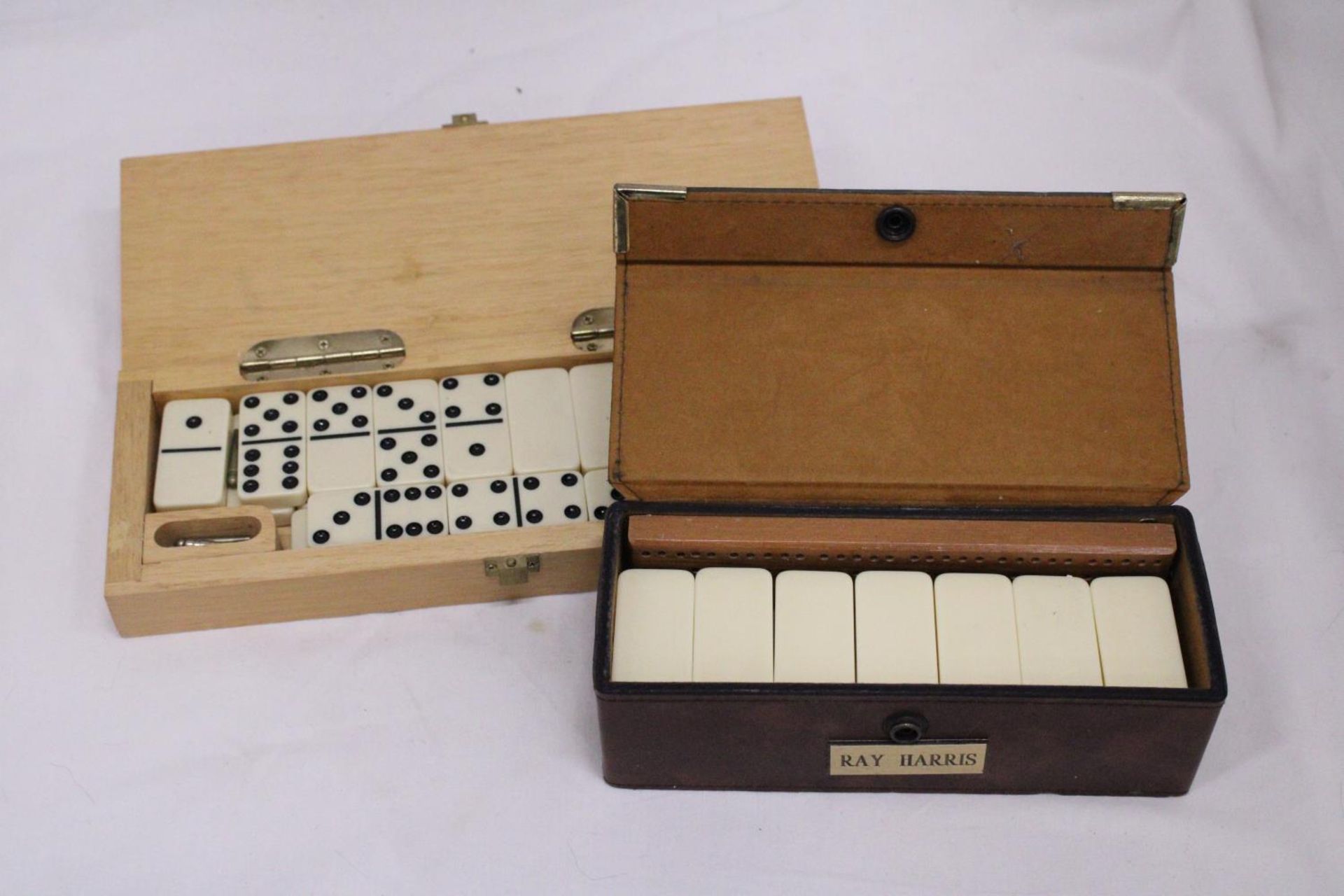 TWO BOXED DOMINO SETS WITH SCORE BOARD