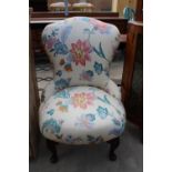 A MODERN FLORAL BEDROOM CHAIR ON FRONT CABRIOLE LEGS