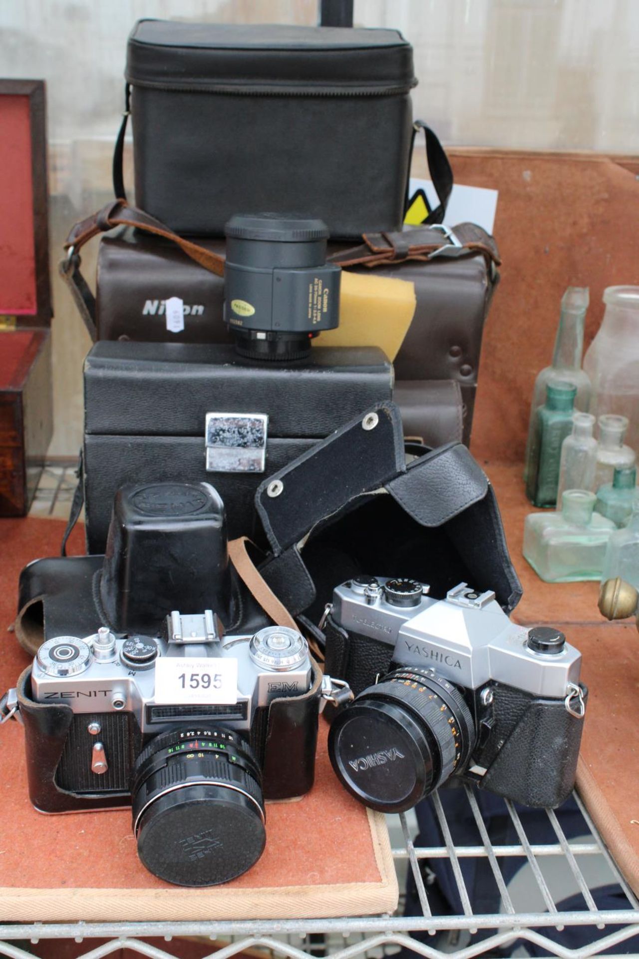 AN ASSORTMENT OF CAMERA EQUIPMENT TO INCLUDE A ZENIT CAMERA, YASHICA CAMERA AND A CANON ZOOM LENS